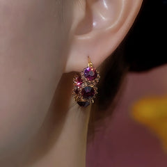 Close-up detail of the sparkling zircons and plating on the Purple Crystal Hoops