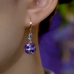 Close-up detail of the sparkling zircons and plating on the Diamond Ball Earrings