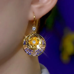 Close-up detail of the sparkling zircons and plating on the Cat's Eye Rose Earrings