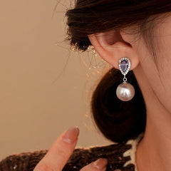 Close-up detail of the sparkling zircons and plating on the Pearl Drop Earrings