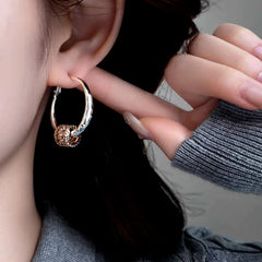 Angled view of the 14K Gold-Plated Elegant Zircon Ring Hoop Earrings