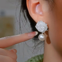 Model showcasing the dangle and style of the 14K Gold-Plated Elegant Zircon Rose Pearl Earrings