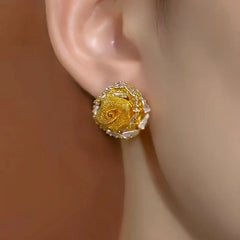 Close-up detail of the sparkling zircons and plating on the Rose Stud Earrings