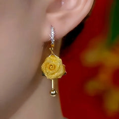 Close-up detail of the sparkling zircons and plating on the Rose Tassel Earrings