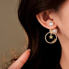 Close-up detail of the sparkling zircons and plating on the Star Pearl Earrings