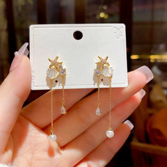 Close-up detail of the sparkling zircons and plating on the Starfish Tassel Earrings