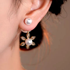 Model showcasing the dangle and style of the 14K Gold-Plated Elegant Zircon Sun Pearl Jacket Earrings