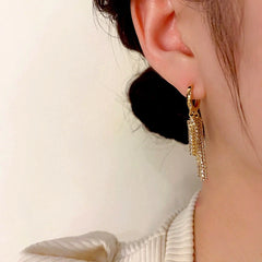 Close-up detail of the sparkling zircons and plating on the Chain Tassel Earrings