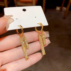 Angled view of the 14K Gold-Plated Elegant Zircon Tassel Earrings