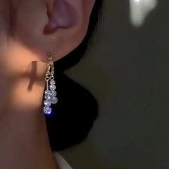 Close-up detail of the sparkling zircons and plating on the Chain Tassel Earrings