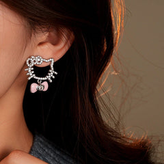 Close-up detail of the sparkling zircons and plating on the Kitten Earrings