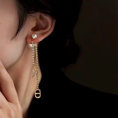 Model showcasing the dangle and style of the 14K Gold-Plated Elegant Zircon Zircon Star Pearl Earrings