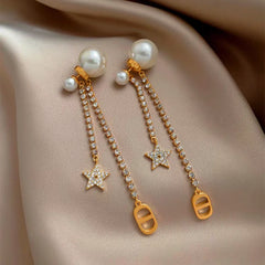 Angled view of the 14K Gold-Plated Elegant Zircon Zircon Star Pearl Earrings
