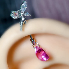 Model showcasing the dangle and style of the 14K Gold-Plated Elf Heart Earrings