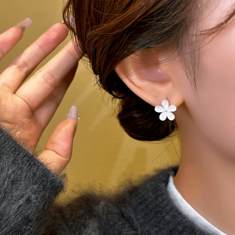 Close-up detail of the sparkling zircons and plating on the Flower Hoop Earrings