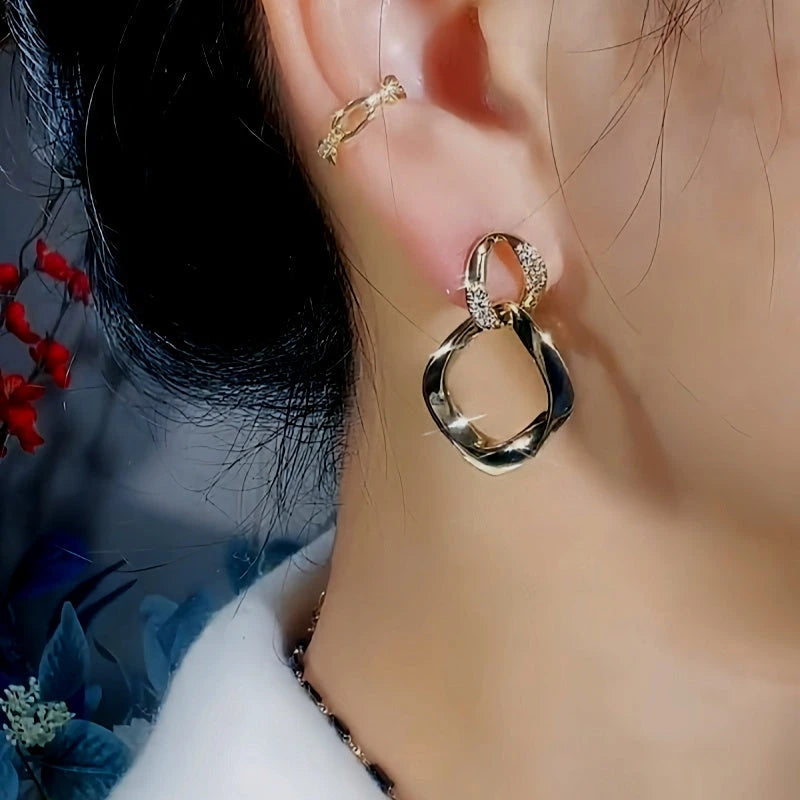 Close-up detail of the sparkling zircons and plating on the Interlocking Earrings