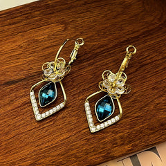 Angled view of the 14K Gold-Plated Exquisite Diamond Flower Crystal Earrings