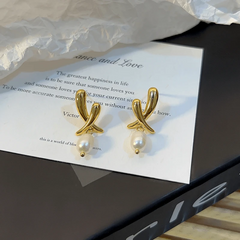 Angled view of the 14K Gold-Plated Exquisite Simple Bead Drop Earrings