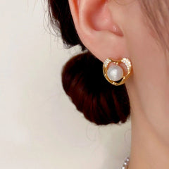 Close-up detail of the sparkling zircons and plating on the Pearl Heart Stud Earrings