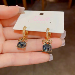 Angled view of the 14K Gold-Plated Exquisite Square Diamond Bow Zircon Earrings