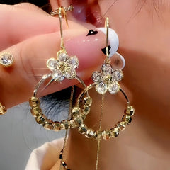 Close-up detail of the sparkling zircons and plating on the Flower Threader Earrings