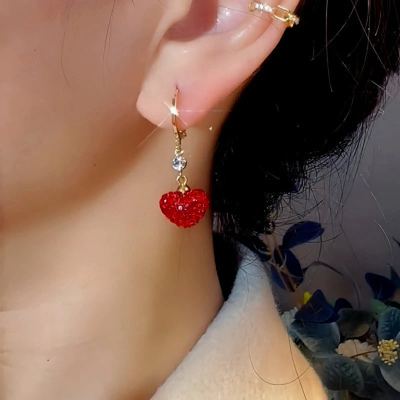 Close-up detail of the sparkling zircons and plating on the Red Heart Earrings