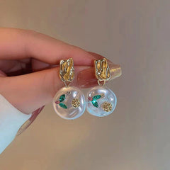 Angled view of the 14K Gold-Plated Flower Baroque Pearl Earrings