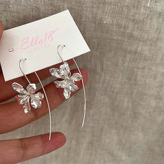 Angled view of the 14K Gold-Plated Flower Ear Hook Earrings