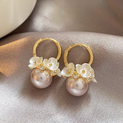 Angled view of the 14K Gold-Plated Flower Pearl Earrings