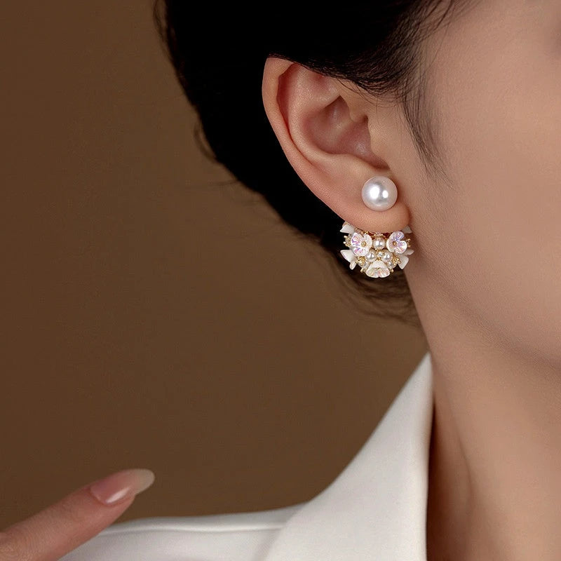 Close-up detail of the sparkling zircons and plating on the Flower Pearl Jacket Earrings