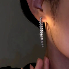 Close-up detail of the sparkling zircons and plating on the Zircon Tassel Earrings