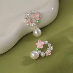 Angled view of the 14K Gold-Plated Garland Pearl Earrings