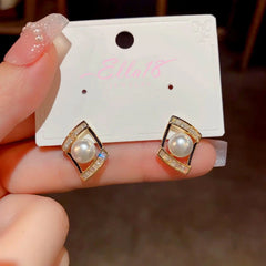 Angled view of the 14K Gold-Plated Geometric Zircon Pearl Earrings