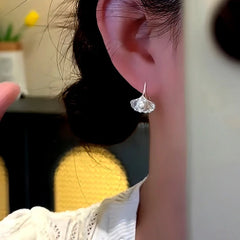 Close-up detail of the sparkling zircons and plating on the Ginkgo Leaf Ear Hooks