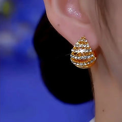 Model showcasing the dangle and style of the 14K Gold-Plated Glaze Purple Double-Sided Water Drop Earrings