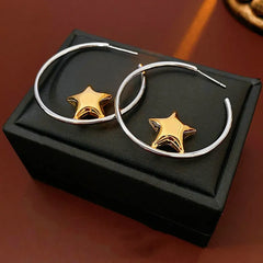 Close-up detail of the sparkling zircons and plating on the Star Hoop Earrings