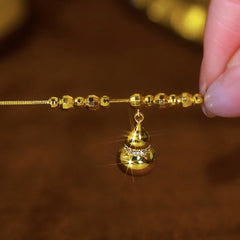 Close-up of the pendant and clasp on the Gourd Luck Necklace
