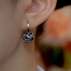 Close-up detail of the sparkling zircons and plating on the Gray Zircon Earrings
