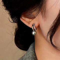 Close-up detail of the sparkling zircons and plating on the Gray Pearl Earrings