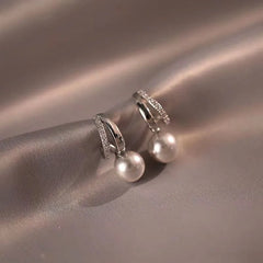 Angled view of the 14K Gold-Plated Gray Pearl Earrings