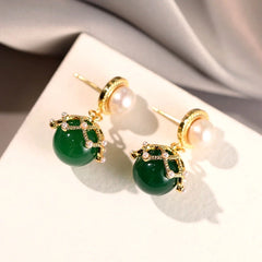 Angled view of the 14K Gold-Plated Green Pearl Earrings