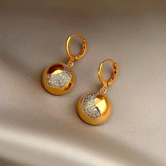 Angled view of the 14K Gold-Plated Half-Circle Crescent Earrings