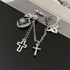 Model showcasing the dangle and style of the 14K Gold-Plated Heart-Design Cross Ear Clip Tassel Earrings