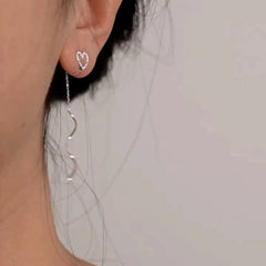 Close-up detail of the sparkling zircons and plating on the Heart Tassel Cuff