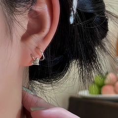 Close-up detail of the sparkling zircons and plating on the Heart Threader Earrings