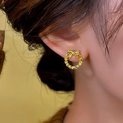 Close-up detail of the sparkling zircons and plating on the Hollow Bow Studs