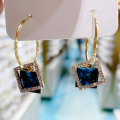 Angled view of the 14K Gold-Plated Hollow Crystal Earrings
