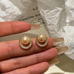 Close-up detail of the sparkling zircons and plating on the Pearl Studs