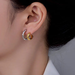 Model showcasing the dangle and style of the 14K Gold-Plated Hollow Double-Layer Stud Earrings
