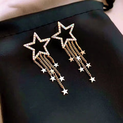 Close-up detail of the sparkling zircons and plating on the Star Tassel Earrings